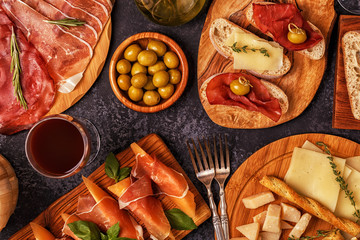 Italian food  background with ham, cheese, olives.