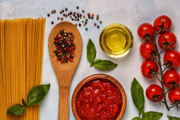 Italian food background with pasta, spices and vegetables.