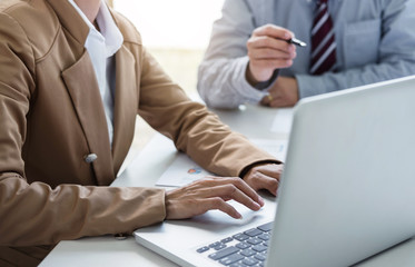 Team work process, Two business managers crew working with new start up project. laptop, tablet on wood table in office