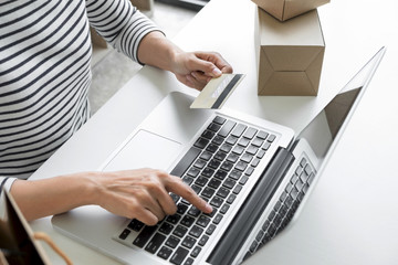 Woman's hands using credit card register and payments online shopping and customer service network connection market, using technology on laptop, Internet Online shopping or internet banking concept