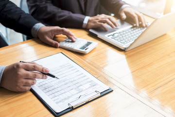 Co working conference, Business team meeting present, investor colleagues discussing new plan financial graph data on office table with laptop and calculator, Finance, accounting, investment