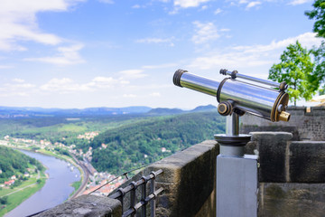 KOENIGSTEIN, GERMANY - MAY 2017: Telescope on top Konigstein Fortress observation deck.