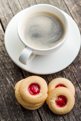 Sweet jelly cookies and coffee cup.