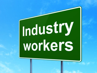 Manufacuring concept: Industry Workers on green road highway sign, clear blue sky background, 3D rendering