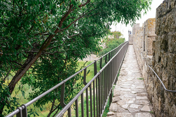 Fototapeta na wymiar The walls surrounding the Old City of Jerusalem, ramparts walk along the top of the stone walls