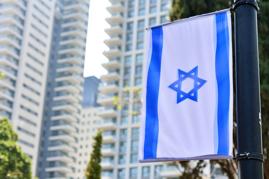 skyline cityscape with national Israeli flag and high rise hotel buildingsTel Aviv Israel