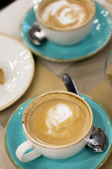 Cup of coffee latte art on a table