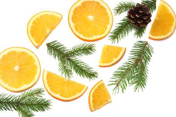 Fototapeta na wymiar Christmas background. sliced orange with cone and fir tree isolated on white background top view