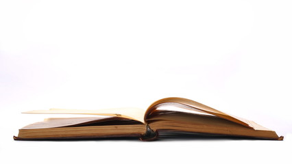 Open old book isolated on white