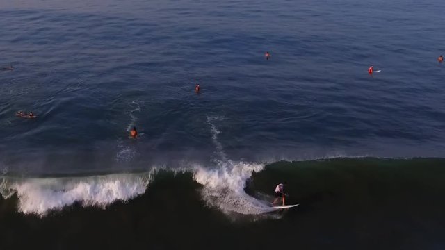 Surfer riding on the Wave in Hawaii. Aerial view drone