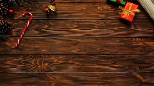 Top view of wooden table with Christmas decorations, empty desk