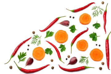 mix red hot chili peppers with parsley and sliced carrot and garlic isolated on white background top view