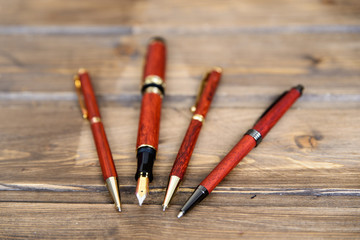 wooden writing pens on a wooden table - 182891995