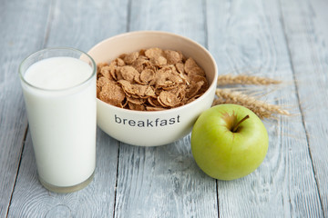 yogurt,cereal and an Apple for a healthy Breakfast