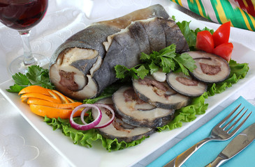 Roll of leather, sheep fat,meat lamb with spices.Served cold with salad greens, onion.Uzbek cuisine.