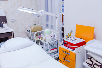 Cosmetic couch, equipment and cosmetics in beauty salon interior