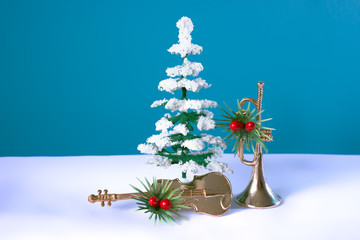 Snowy tree with violin and trumpet