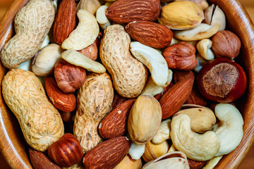 Assorted nuts in wooden bowl
