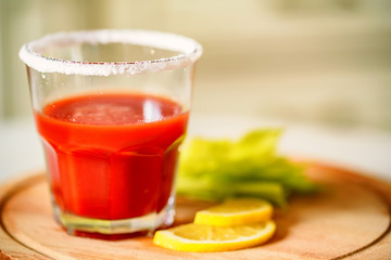 Bloody Mary alcoholic drink with lemon and celery