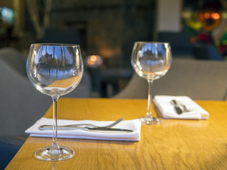 Wine glasses on the table. Serving.