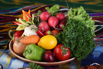 Set of vegetables and herbs for the salad on a platter.