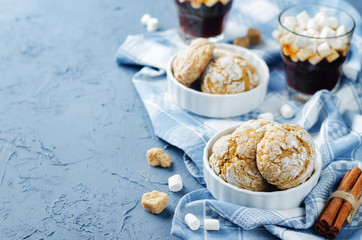 Pumpkin cookies with cups of coffee