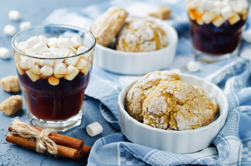 Pumpkin cookies with cups of coffee