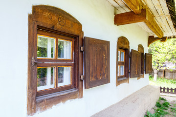 Fototapeta na wymiar Windows with wooden shutters. Traditional Ukrainian house