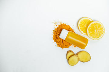 Ginger shot healthy drink with curd in a plastic bottle on white background. Immunity Boosting Tonic. Space for text