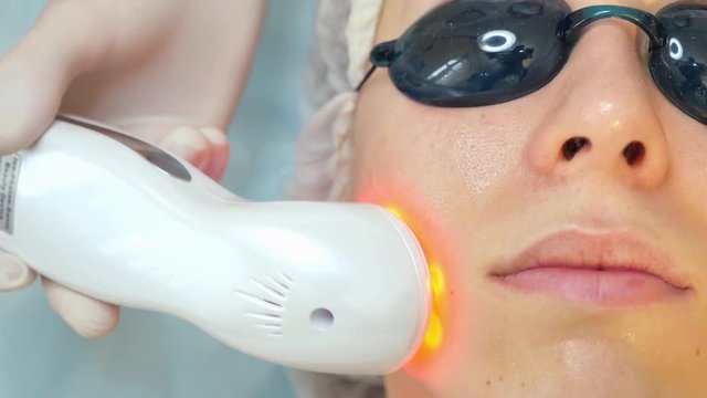 Skin Rejuvenation Treatment, Woman facial rejuvenation salon receive skin treatment.