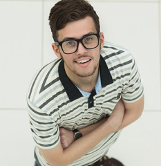 view from the top.successful young man with glasses looking at camera