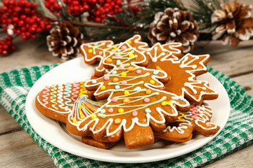 Christmas cookies on a plate on a wooden surface