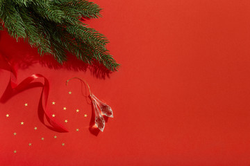 Christmas decors on red background, flat lay