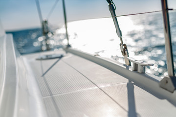Fototapeta premium Sailing boat detail. Sunlight and part of luxury yacht