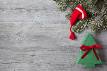 Christmas wooden background with spruce branches, box with gift