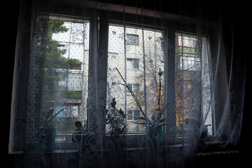 Window in the dark and curtains