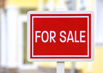 "For sale" sign outdoors