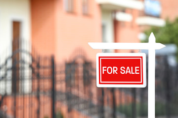 "For sale" sign outdoors
