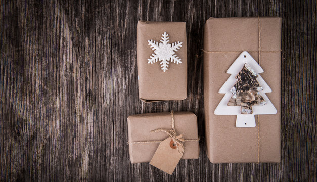 Christmas gift boxes collection on rustic wood and copy space