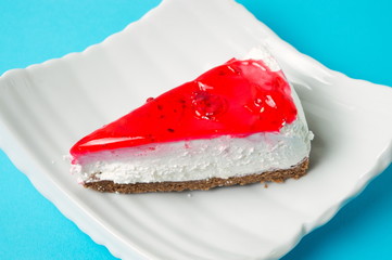 strawberry cheesecake slice on a plate