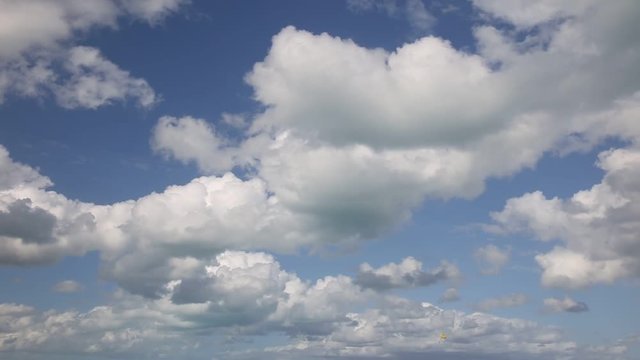 Clouds flying on blue sky background
