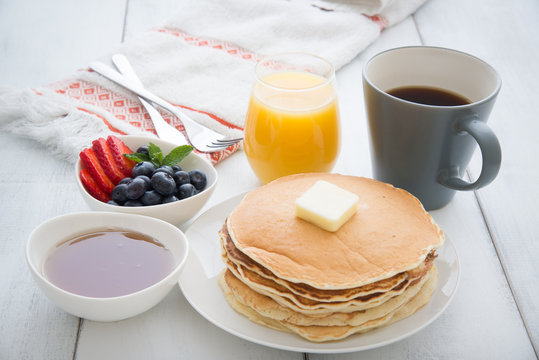 breakfast image with pancake, coffee, orange juice