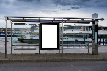 blank advertisement in a bus stop next to the sea and ships in istanbul city