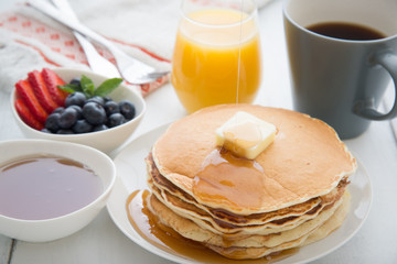 breakfast image with pancake, coffee, orange juice
