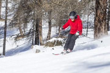 Fototapeta na wymiar Child skiing on snow slope