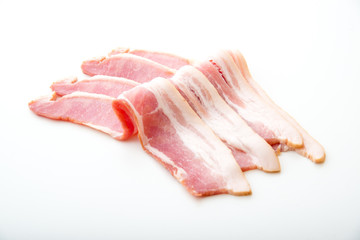 isolated raw bacon on white background