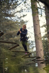 woman on rope bridge