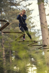 woman on rope high wore bridge