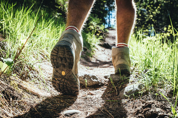 Hiking man in the forest and close up hiking boots