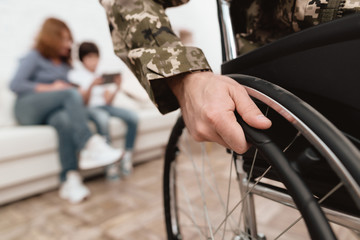 Veteran in wheelchair returned from army. Close-up photo veteran in a wheelchair.